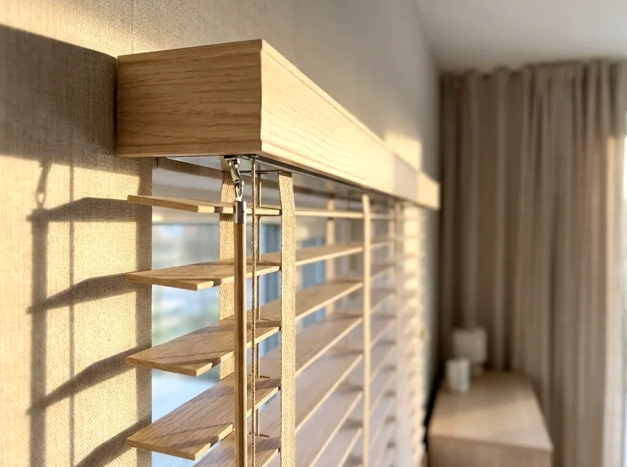 Close-up of a blind headrail and tilt mechanism being serviced during a blind repair in a Bedfordview home